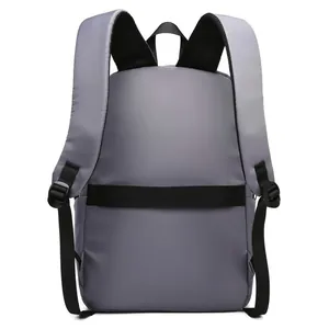 Men's grey business backpack with padded straps and luggage strap shown from back view