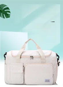 Quilted beige duffle bag featuring multiple front pockets and large storage capacity