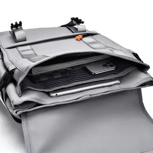 Grey waterproof laptop backpack with multi-layer storage and orange zippers for students
