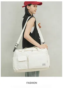 Side view of white quilted travel bag with large capacity and separate shoe compartment