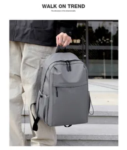Detail of durable grey nylon backpack with dual zippers and side drawstring pockets