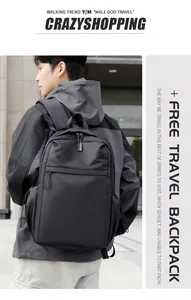 Detail of a sleek black travel backpack featuring a dual-zipper compartment and side pocket