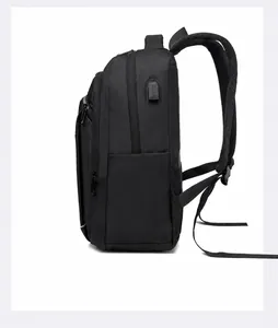 Side view of black business backpack featuring an external USB charging port and breathable straps