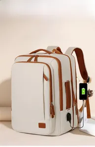 Close-up of beige travel backpack with USB charging port and breathable mesh straps