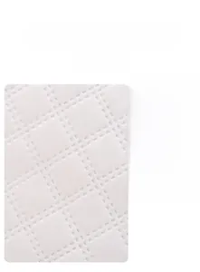 Close-up of diamond quilted fabric showing soft, wear-resistant and anti-pilling texture
