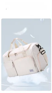 Beige quilted travel bag with shoe compartment and light fabric shown on a soft blue background