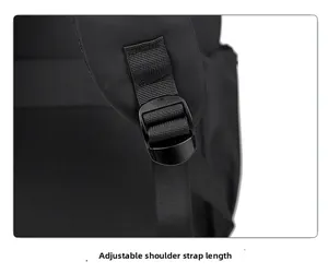 Detail of adjustable black shoulder strap with durable plastic buckle on a nylon backpack