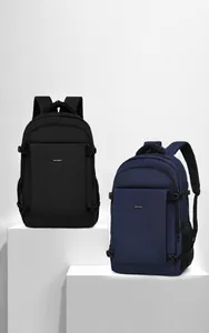 Dual business backpacks in black and navy showing front pockets and ergonomic side buckles