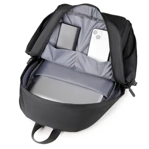 Black fashion backpack with gray lining showing laptop compartment and interior pockets