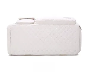 Detail view of the quilted diamond pattern on the base of the large travel duffle bag