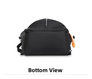 Bottom view of black nylon backpack featuring durable seams and orange decorative tag