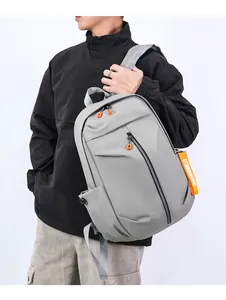 Detail of light grey backpack with bright orange zippers and side fashion straps