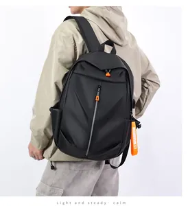 Detail of black multi-functional backpack featuring vibrant orange zipper accents and straps