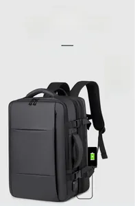 Detail of expandable black travel backpack showing dual USB and Type-C external charging ports