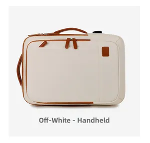 Detail view of the off-white travel backpack with brown leather handles and dual zippers
