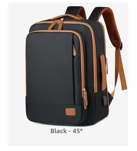 Detail of black expandable travel backpack showing USB charging port and side handle