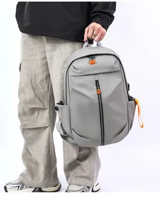 Close-up of gray waterproof business backpack with a black zipper and orange decorative pull