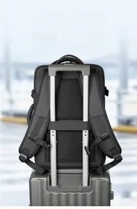 Travel backpack featuring luggage strap system for hands-free convenience at airport