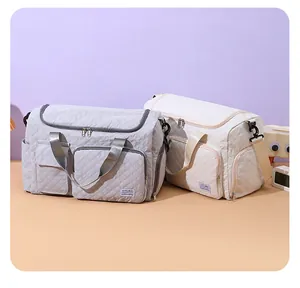 Quilted travel bags in grey and cream with large main compartment and shoe storage