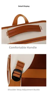 Detail of cream backpack showing padded carry handle and adjustable shoulder strap buckles