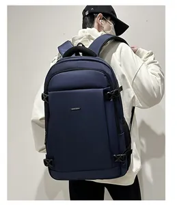 Detail view of large navy blue waterproof business backpack on a person for commuting