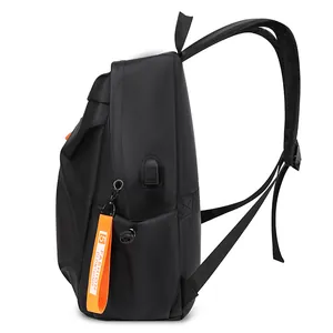 Minimalist black multi-functional backpack with orange decorative strap and USB port