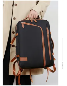 Detail of laptop backpack showing durable black fabric with elegant brown leather trim