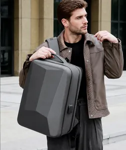 Detail of hard shell gaming backpack featuring USB charging port and TSA combination lock