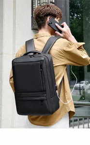Detail of waterproof matte black business backpack showing external USB charging port