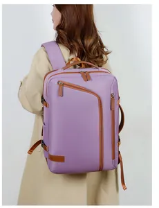 Detail of purple laptop backpack with brown leather trim shown on person for size scale