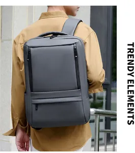 Man wearing gray waterproof business laptop backpack featuring ergonomic padded shoulder straps