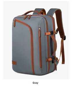 Detail view of large capacity gray travel backpack with side handle and buckle