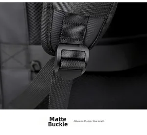 Macro detail of the matte black buckle on adjustable nylon straps for travel backpack