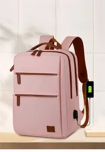 Pink commute backpack with external USB port and brown accents for mobile charging