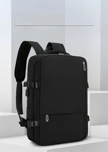 Close-up of black travel backpack with breathable straps and USB port on geometric background