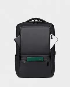 Detail view of multi-compartment storage in black waterproof business laptop backpack