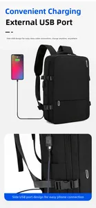 Detail of travel backpack showing integrated USB charging port and water-resistant fabric