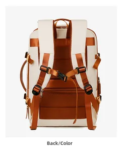 Detail view of ergonomic padded shoulder straps and breathable mesh back of travel backpack