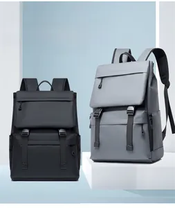 Detail of multi-compartment travel backpack showing waterproof fabric and buckle closures