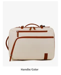 Detail of travel backpack with cream fabric, brown leather trim and multi-pocket design
