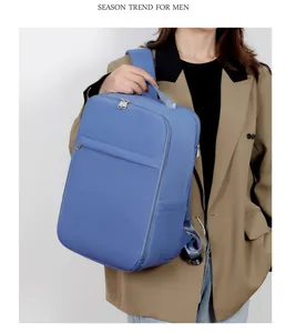 Detail view of the premium foggy blue fabric and smooth metal zipper on the backpack