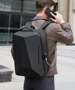Detail view of black hard shell gaming backpack with built-in external USB charging port