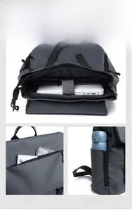 Macro view of a dark gray backpack featuring a dedicated laptop sleeve and storage pockets