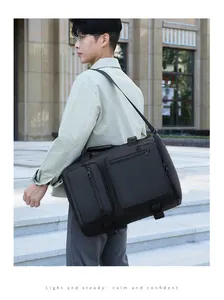 Detail of waterproof matte fabric and reinforced zippers on black multi-pocket business bag