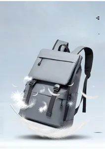 Detail of gray lightweight travel backpack with feather accent to show ultra light weight