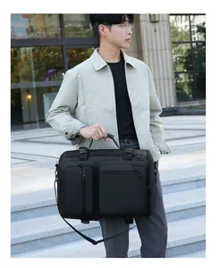 Detail of multi-functional black travel bag with dual zipper pockets and top handle