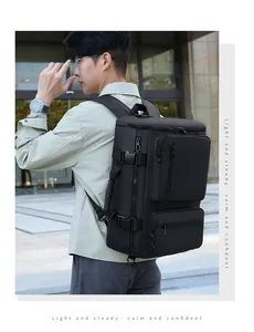 Detail view of the durable black multi-compartment travel backpack with compression straps