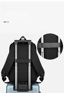 Detail of travel backpack with integrated luggage sleeve for suitcase handle attachment