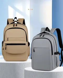 Front view of khaki and grey casual backpacks with multiple pockets on display stands
