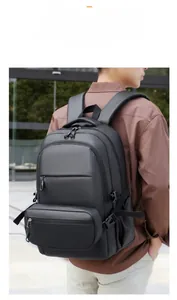 Close-up of black casual laptop backpack featuring multi-layer zippers and side buckles